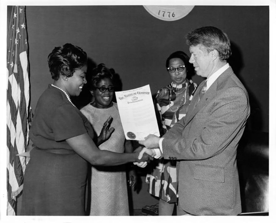 Photo: President Carter presents a Maids Day Proclamation to Dorothy Bolden in 1970. Source: U.S. DOL, citing Georgia State University.